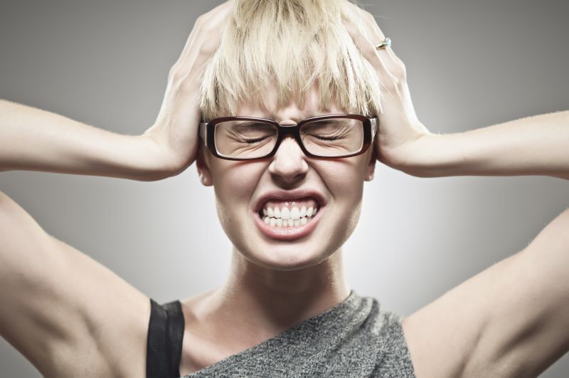 Teethgrinding - frustrated woman